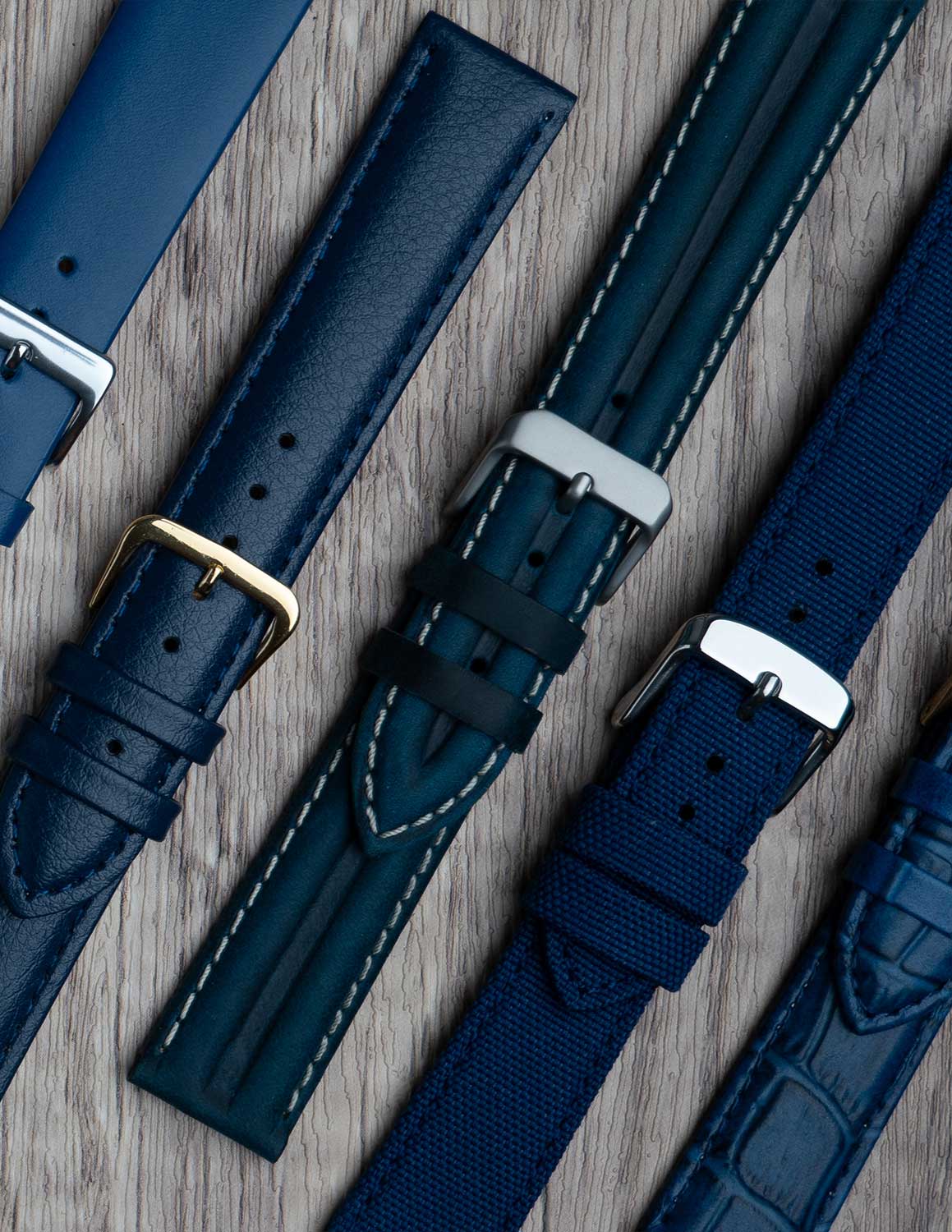 A selection of blue watch straps showing the different grains of leather and styles.