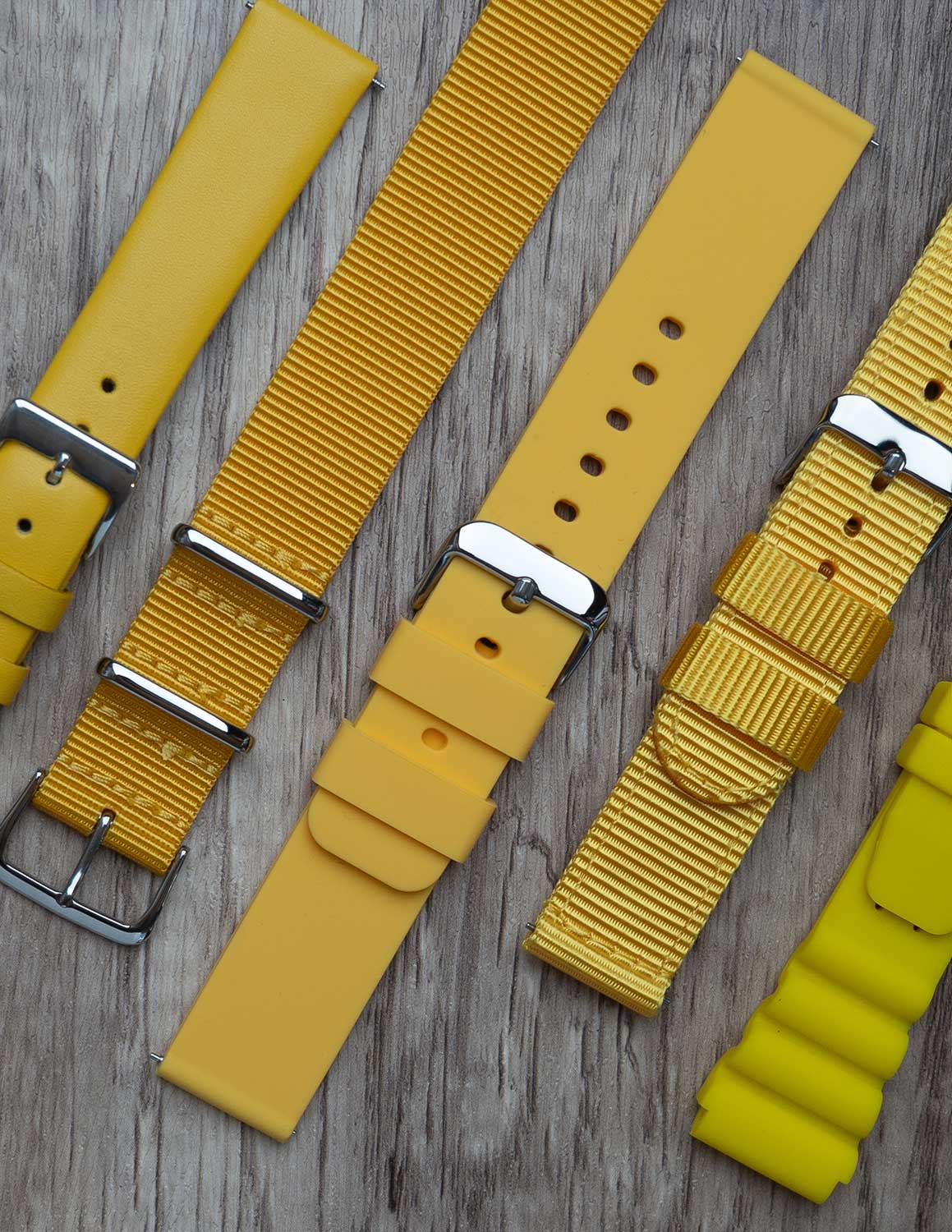 A selection of yellow watch straps showing the different grains of leather and styles.