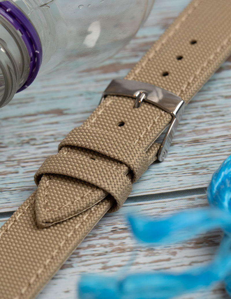 A close up image of a eco / sustainable watch strap made from recycled ocean plastic.