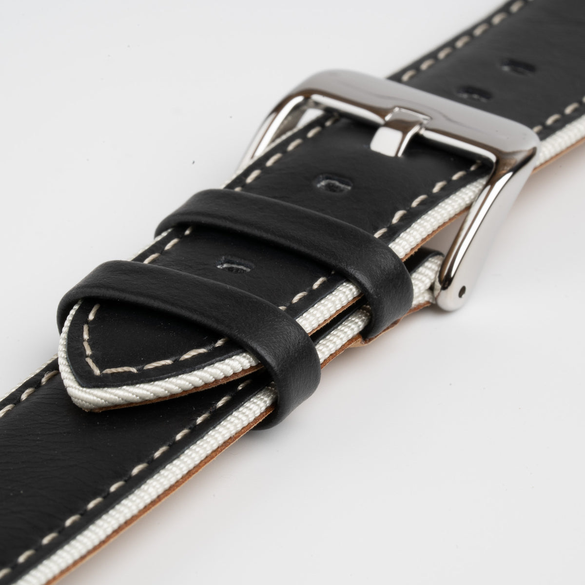 Black Mayfair Nylon Edge watch strap, close-up of the buckle and keepers