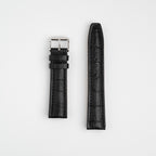 Black Mayfair Contour watch strap, laid flat with its buckle