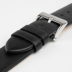 Close-up of the polished silver buckle and leather keepers on the Windsor Smooth black strap