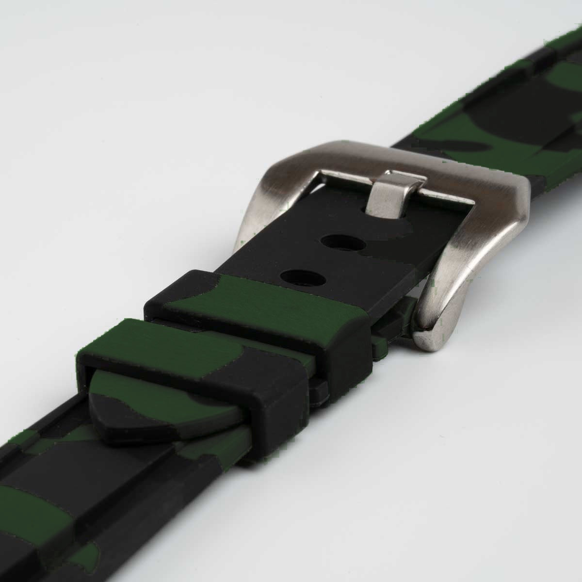 Close-up of the dark green camo strap's buckle and keepers