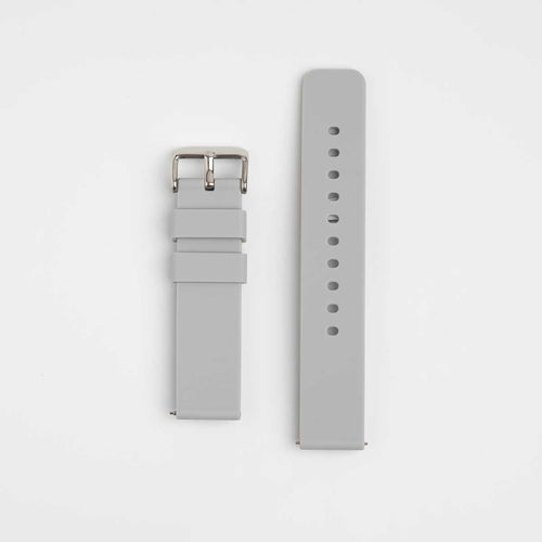 A grey silicone watch strap with a quick release mechanism and a silver buckle, displayed flat on a white background.