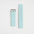 Light blue watch strap with silver buckle on a light gray background