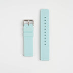Light blue watch strap with silver buckle on a light gray background