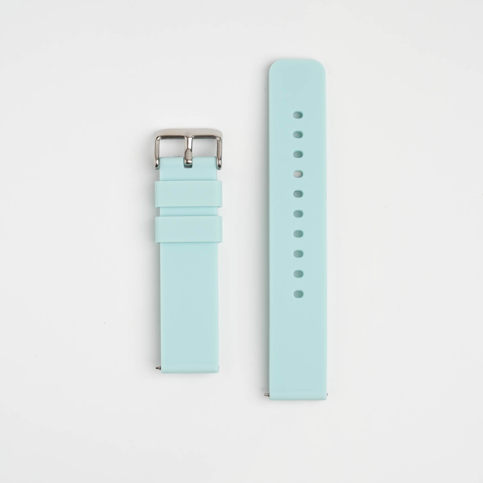 Light blue watch strap with silver buckle on a light gray background