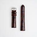 Morellato tiepolo brown alligator grain leather watch strap with a silver buckle, displayed flat on a white background.
