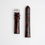 Morellato tiepolo brown alligator grain leather watch strap with a silver buckle, displayed flat on a white background.