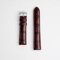 Morellato tiepolo red leather watch strap with alligator grain pattern, laid out flat against a white background.