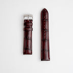 Morellato tiepolo red leather watch strap with alligator grain pattern, laid out flat against a white background.