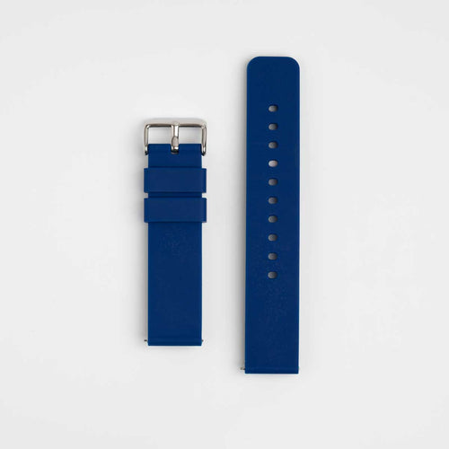 A navy blue silicone watch strap with a silver buckle laid out flat on a white background.