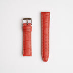 Red Mayfair Alligator watch strap, laid flat with its buckle