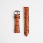 Tan Mayfair Alligator watch strap, laid flat with its buckle