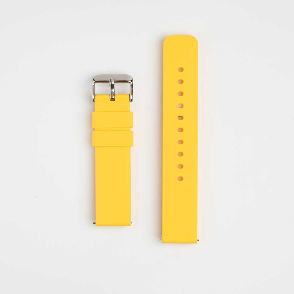 A yellow silicone watch strap with a silver buckle on a white background.